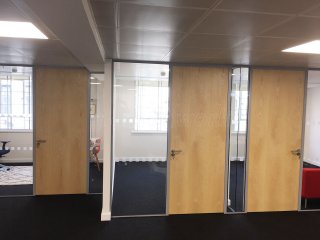 Above & Beyond Construction Ltd (Haymarket, London): Multi-Office Full Floor Fit-Out with Timber Doors & Toughened Glass Partitions