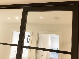 Chase New Homes Limited (Hertford, Hertfordshire): T-Bar Glazed Partitioning with Framed Sliding Door Leaves in multiple Properties