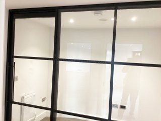 Chase New Homes Limited (Hertford, Hertfordshire): T-Bar Glazed Partitioning with Framed Sliding Door Leaves in multiple Properties