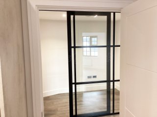 Chase New Homes Limited (Hertford, Hertfordshire): T-Bar Glazed Partitioning with Framed Sliding Door Leaves in multiple Properties