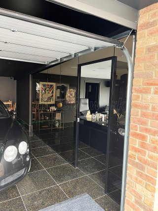 RE-Q 23 Construction Limited (York, North Yorkshire): Bronzed Glass Partitions With Black Tracks For Garage and Home Gym