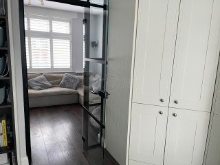 Residential Project (Wandsworth, London): Toughened Safety Glass Black Framed Panelled Door