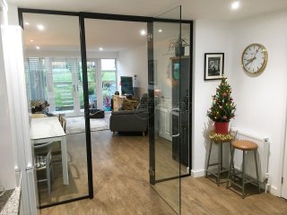 Domestic Project (Norwich, Norfolk): Glass Wall and Door With Black Metal Frame