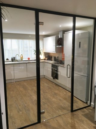 Domestic Project (Norwich, Norfolk): Glass Wall and Door With Black Metal Frame