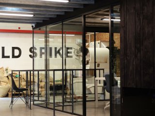 OLD SPIKE (Peckham, London): Acoustic Glass Corner Room With Vertical Black Trims & Black Frame