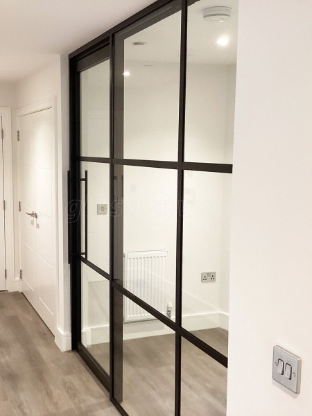 Chase New Homes Limited (Hertford, Hertfordshire): T-Bar Glazed Partitioning with Framed Sliding Door Leaves in multiple Properties