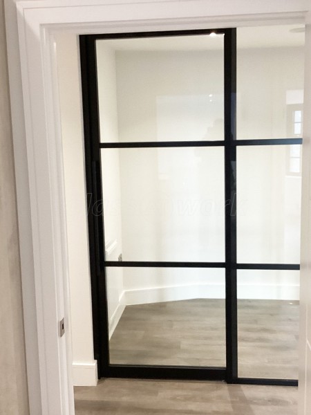 Chase New Homes Limited (Hertford, Hertfordshire): T-Bar Glazed Partitioning with Framed Sliding Door Leaves in multiple Properties