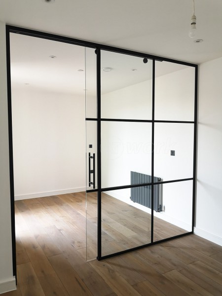 Dawlish Construction (Stepney, London): T-Bar Black Panel Glass Walls and Sliding Doors