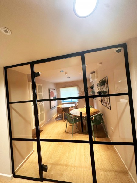 Fortis Vision (Tottenham, London): Laminated Acoustic T-Bar Banded Glass Partition