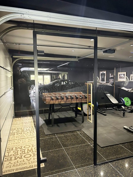 RE-Q 23 Construction Limited (York, North Yorkshire): Bronzed Glass Partitions With Black Tracks For Garage and Home Gym