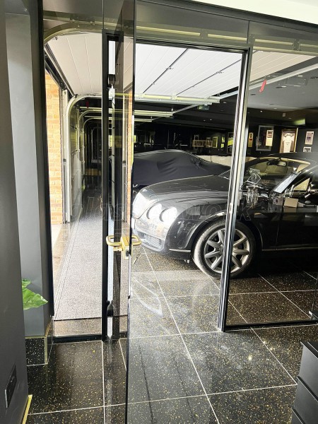 RE-Q 23 Construction Limited (York, North Yorkshire): Bronzed Glass Partitions With Black Tracks For Garage and Home Gym