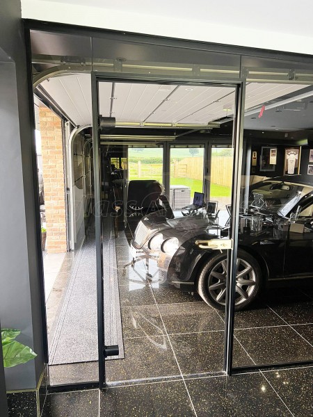 RE-Q 23 Construction Limited (York, North Yorkshire): Bronzed Glass Partitions With Black Tracks For Garage and Home Gym