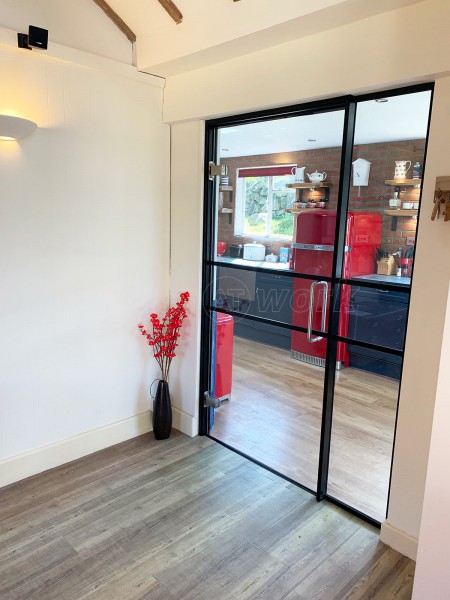 Residential Project (Pwllheli, Wales): T-Bar Black Framed Glass Door and Side Panel