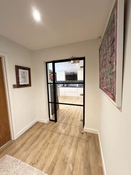 Domestic Project (Seaford, East Sussex): T-Bar Aluminium Black Framed Glass Doors