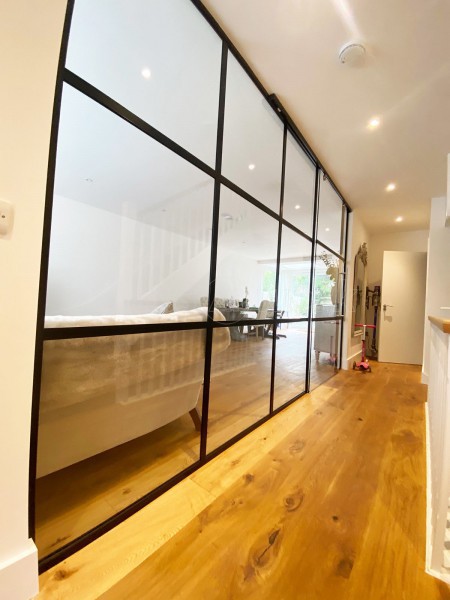 AOD Contracts (Twickenham, London): Industrial Style Interior Glass Wall With Large Sliding Door