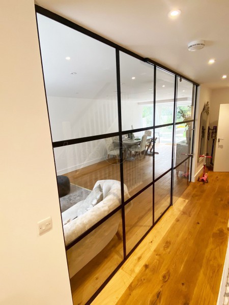 AOD Contracts (Twickenham, London): Industrial Style Interior Glass Wall With Large Sliding Door