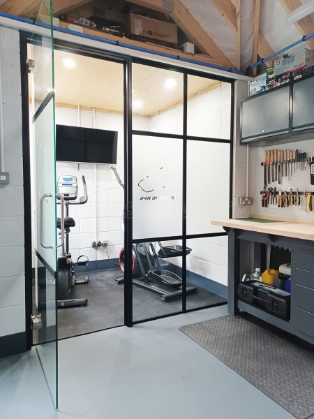 Domestic Garage (Chelmsford, Essex): T-Bar Black Framed Metal and Glass Wall For a Garage / Workshop / Home Gym