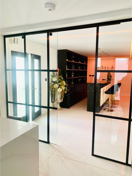 Domestic Project (Chigwell, Essex): Toughened Glass T-Bar Sliding Door Partition