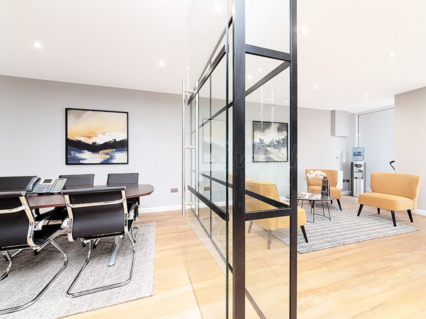 Madison Brook (Royal Victoria Dock, London): Panelled Glazed Industrial-Style Glass Corner Room