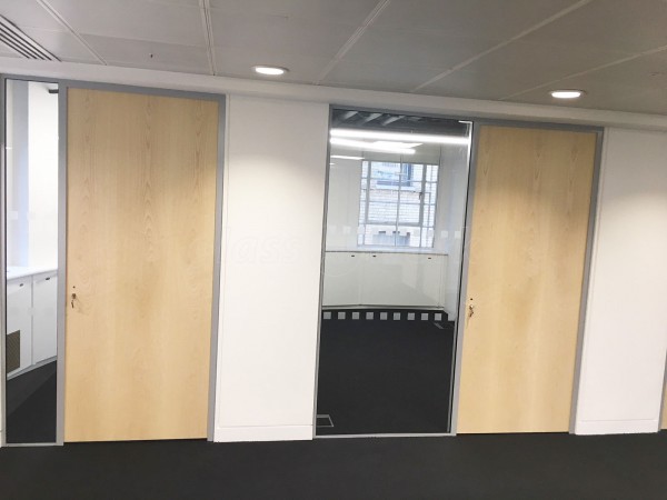 Above & Beyond Construction Ltd (Haymarket, London): Multi-Office Full Floor Fit-Out with Timber Doors & Toughened Glass Partitions