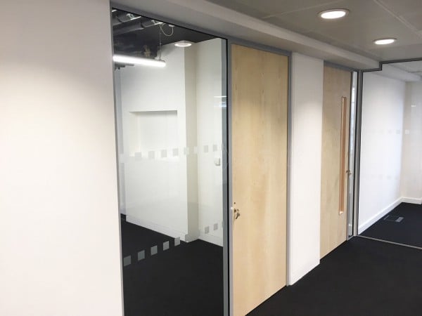 Above & Beyond Construction Ltd (Haymarket, London): Multi-Office Full Floor Fit-Out with Timber Doors & Toughened Glass Partitions