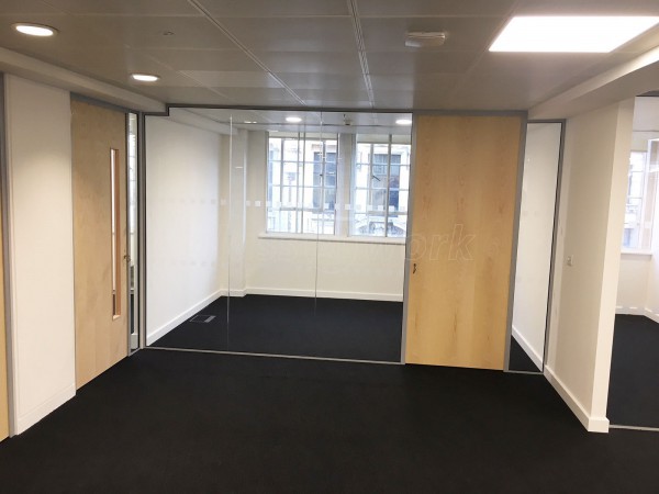 Above & Beyond Construction Ltd (Haymarket, London): Multi-Office Full Floor Fit-Out with Timber Doors & Toughened Glass Partitions