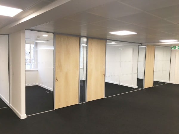 Above & Beyond Construction Ltd (Haymarket, London): Multi-Office Full Floor Fit-Out with Timber Doors & Toughened Glass Partitions