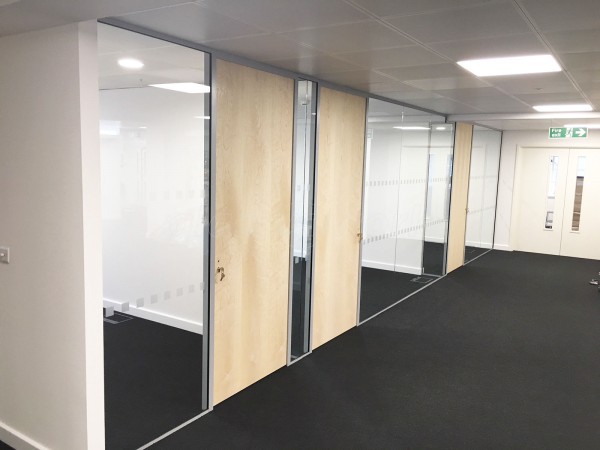 Above & Beyond Construction Ltd (Haymarket, London): Multi-Office Full Floor Fit-Out with Timber Doors & Toughened Glass Partitions