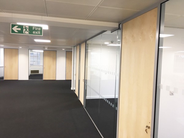 Above & Beyond Construction Ltd (Haymarket, London): Multi-Office Full Floor Fit-Out with Timber Doors & Toughened Glass Partitions