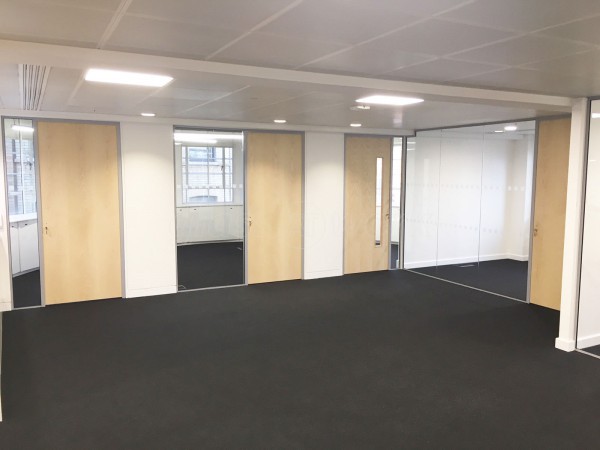 Above & Beyond Construction Ltd (Haymarket, London): Multi-Office Full Floor Fit-Out with Timber Doors & Toughened Glass Partitions