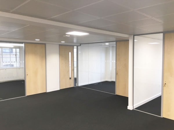 Above & Beyond Construction Ltd (Haymarket, London): Multi-Office Full Floor Fit-Out with Timber Doors & Toughened Glass Partitions