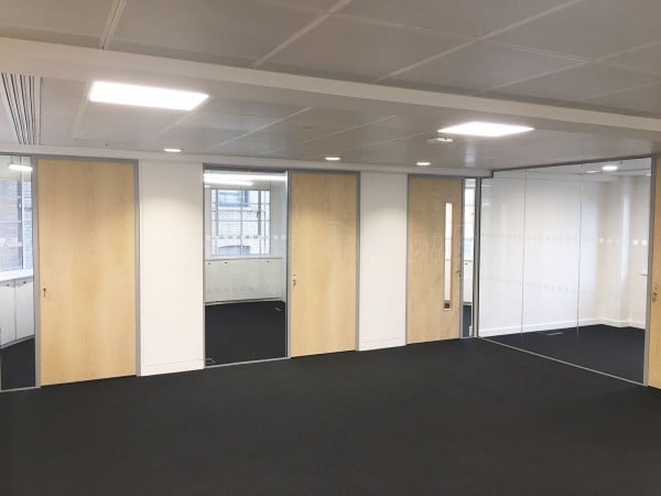 Above & Beyond Construction Ltd (Haymarket, London): Multi-Office Full Floor Fit-Out with Timber Doors & Toughened Glass Partitions