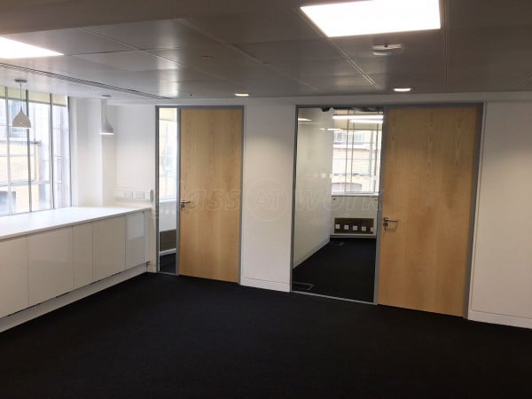 Above & Beyond Construction Ltd (Haymarket, London): Multi-Office Full Floor Fit-Out with Timber Doors & Toughened Glass Partitions