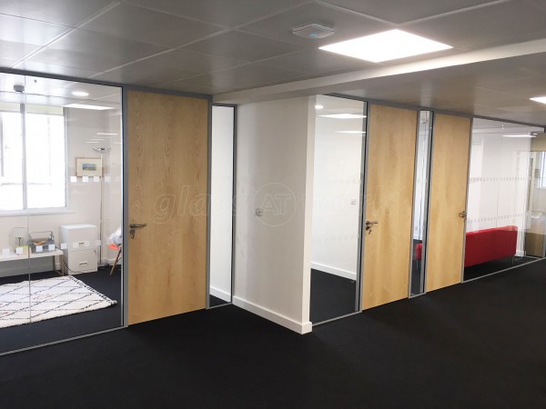 Above & Beyond Construction Ltd (Haymarket, London): Multi-Office Full Floor Fit-Out with Timber Doors & Toughened Glass Partitions