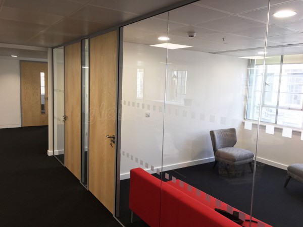 Above & Beyond Construction Ltd (Haymarket, London): Multi-Office Full Floor Fit-Out with Timber Doors & Toughened Glass Partitions