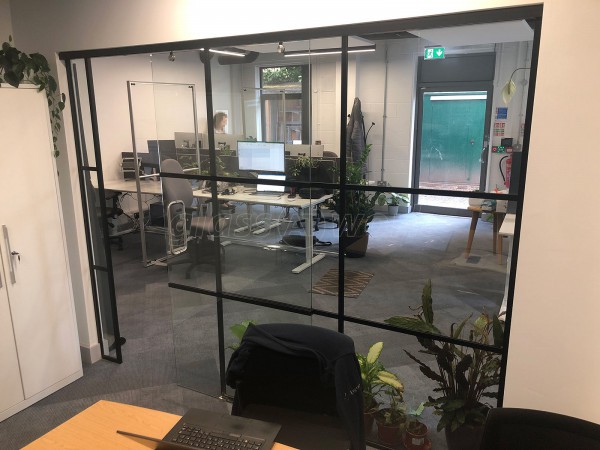 Cardiff Metropolitan University (Cardiff, Caerdydd): Industrial-Look Office Wall With Black Metal Frame and Sliding Door