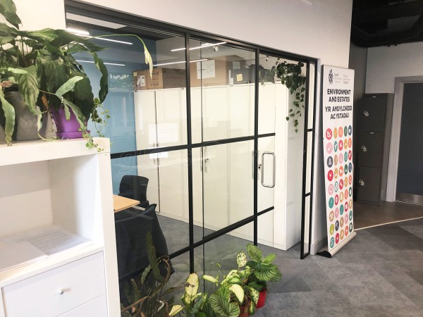 Cardiff Metropolitan University (Cardiff, Caerdydd): Industrial-Look Office Wall With Black Metal Frame and Sliding Door