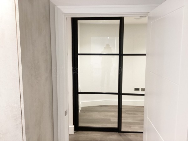 Chase New Homes Limited (Hertford, Hertfordshire): T-Bar Glazed Partitioning with Framed Sliding Door Leaves in multiple Properties