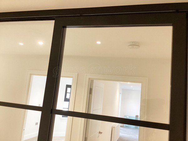 Chase New Homes Limited (Hertford, Hertfordshire): T-Bar Glazed Partitioning with Framed Sliding Door Leaves in multiple Properties