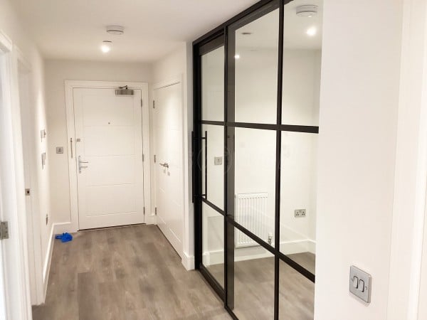 Chase New Homes Limited (Hertford, Hertfordshire): T-Bar Glazed Partitioning with Framed Sliding Door Leaves in multiple Properties