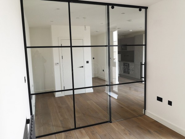 Dawlish Construction (Stepney, London): T-Bar Black Panel Glass Walls and Sliding Doors