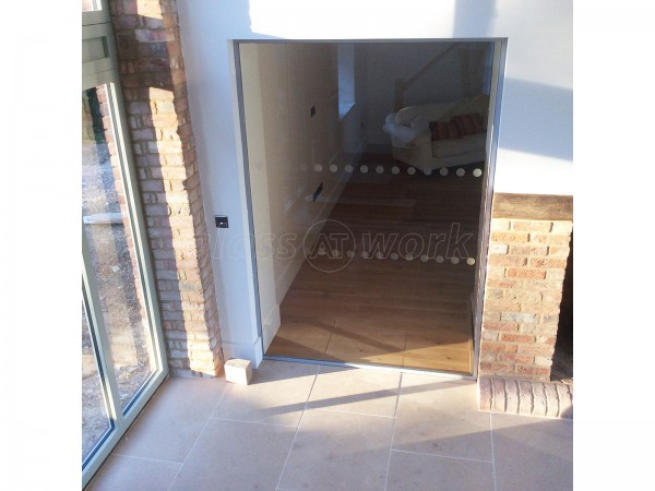 Martin Haynes Construction, Domestic (Towcester, Northamptonshire): Frameless Glass Door and Wall Around Central Fireplace