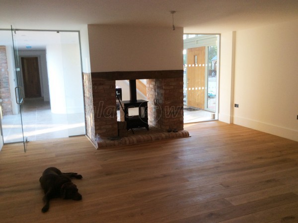 Martin Haynes Construction, Domestic (Towcester, Northamptonshire): Frameless Glass Door and Wall Around Central Fireplace