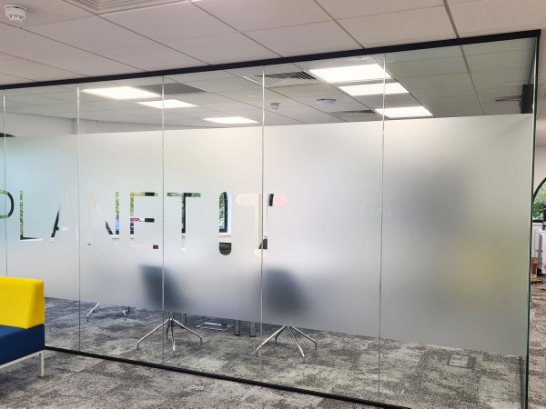 Planet IT (Abingdon, Oxfordshire): Glass Corner Room With Soundproofed Glazing and Bespoke Window Film Graphics
