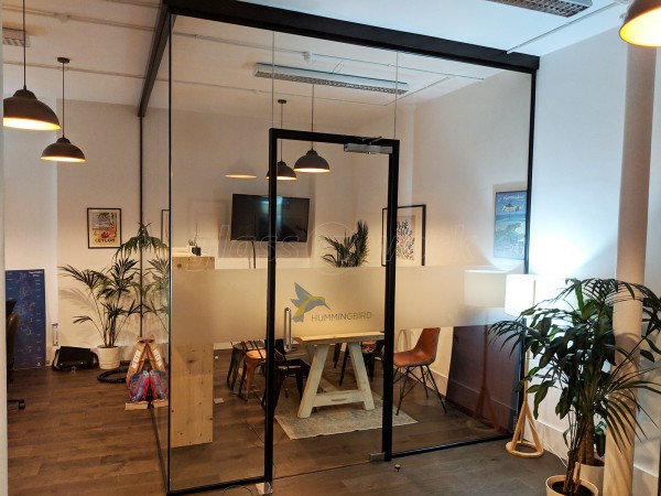 Hummingbird Travel (Brent, London): Corner Glass Meeting Room With Black Track