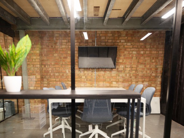 OLD SPIKE (Peckham, London): Acoustic Glass Corner Room With Vertical Black Trims & Black Frame